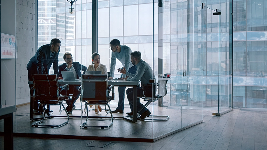 Corporate Leadership Meeting in Modern Conference Room Business professionals meeting in a conference room to discuss organizational strategy and growth initiatives.